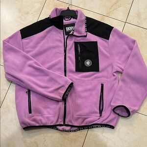 DKNY Sport full zip polar fleece jacket in lavender with black accents.